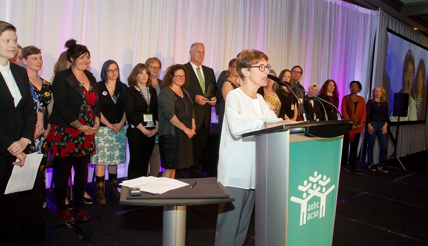 Lynne Raskin, CEO of South Riverdale Community Health Centre, speaks after accepting a Transformative Change Award for the centre's role in achieving government approval for Supervised Injection Services.