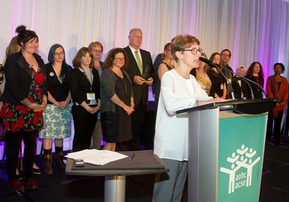 Lynne Raskin, CEO of South Riverdale Community Health Centre, speaks after accepting a Transformative Change Award for the centre's role in achieving government approval for Supervised Injection Services.