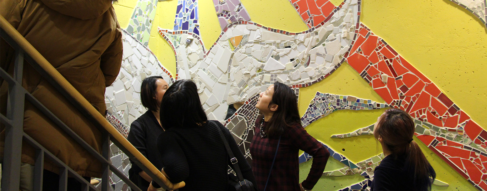 People checking out the mural at South Riverdale Community Health Centre