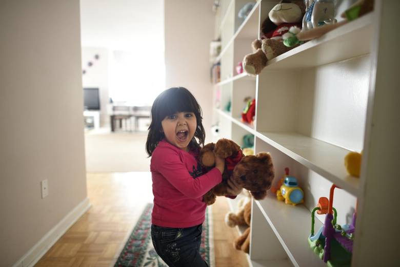 Sava Al Rasoul, 3, beside her wall of stuffed toys near the front door of her family’s apartment.