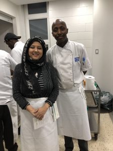 Woman and man chefs in a kitchen