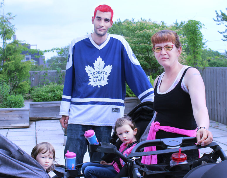 A young family at the rooftop garden in South Riverdale